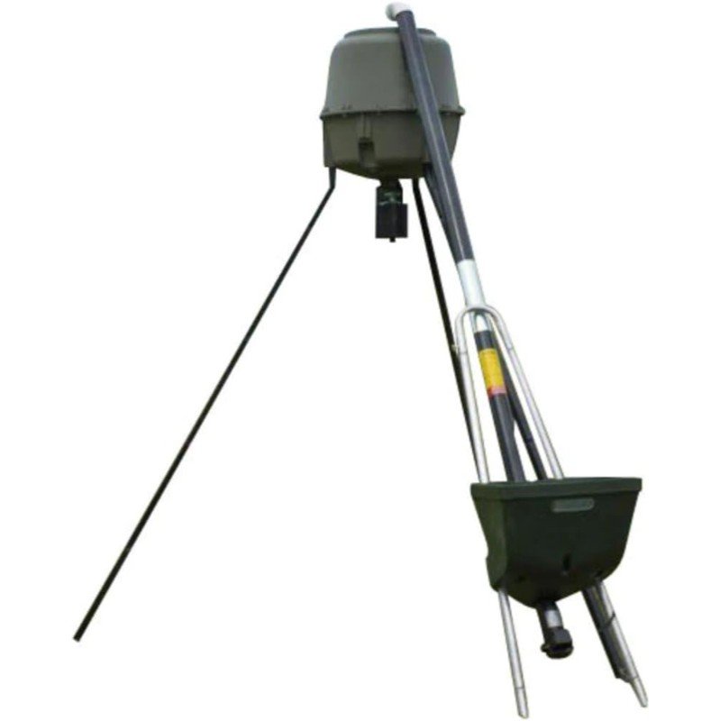 "Feeder filler in use: a compact device efficiently dispensing feed into a game feeder. The device features a straightforward design with clear measurement indicators and an ergonomic handle for easy handling."